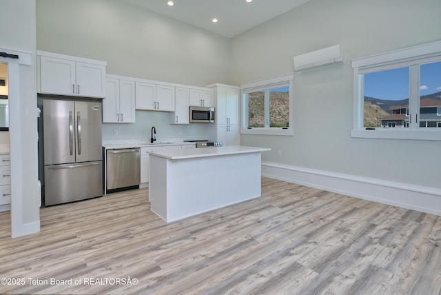 151 Stonefly Ln, Swan Valley, ID 83449 - kitchen featuring a towering ceiling, stainless steel appliances, light countertops, light wood-style floors, and recessed lighting