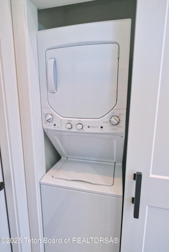 151 Stonefly Ln, Swan Valley, ID 83449 - laundry room featuring estacked washer and dryer
