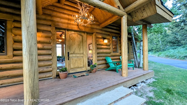 8157 Ripplinger Rd, Driggs, ID 83422 - entrance to property with log siding