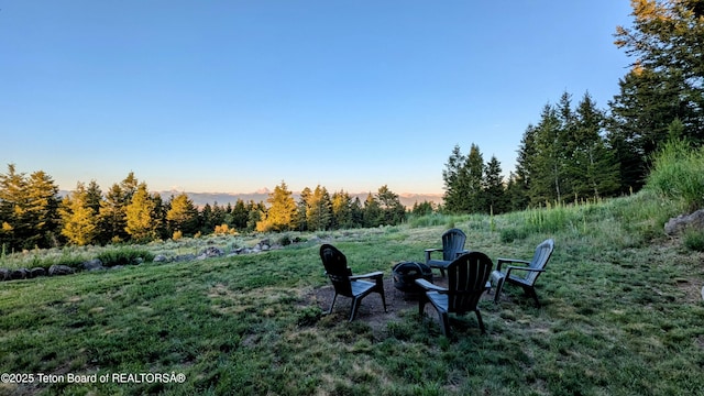 8157 Ripplinger Rd, Driggs, ID 83422 - yard at dusk featuring an outdoor fire pit