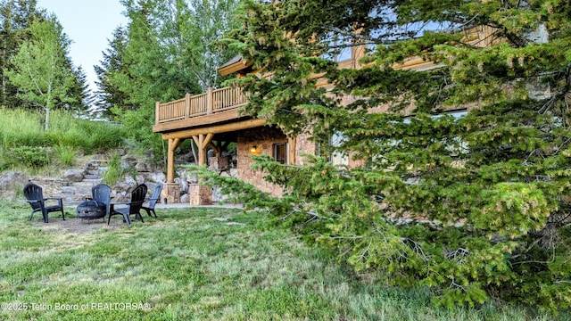 8157 Ripplinger Rd, Driggs, ID 83422 - view of yard with a wooden deck and an outdoor fire pit