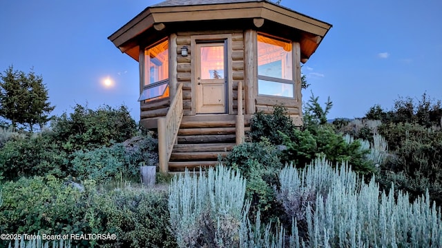 8157 Ripplinger Rd, Driggs, ID 83422 - entrance to property with log exterior