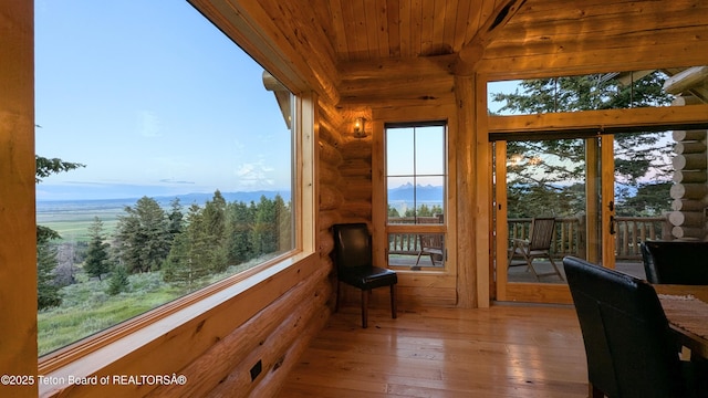 8157 Ripplinger Rd, Driggs, ID 83422 - sunroom / solarium with wooden ceiling, log walls, and hardwood / wood-style floors