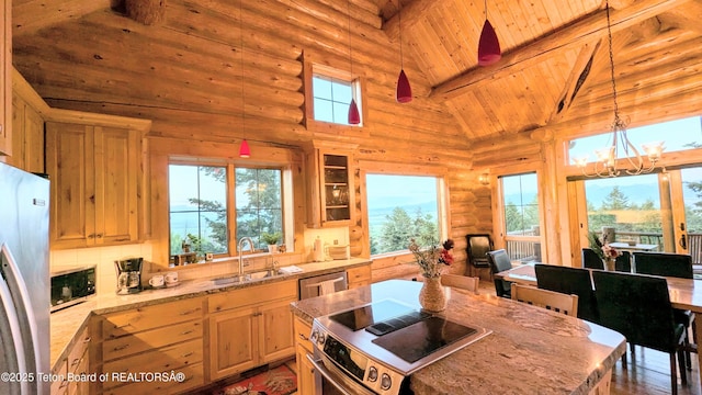 8157 Ripplinger Rd, Driggs, ID 83422 - kitchen featuring appliances with stainless steel finishes, a wooden ceiling with exposed beams, high vaulted ceiling, light stone counters, and a chandelier