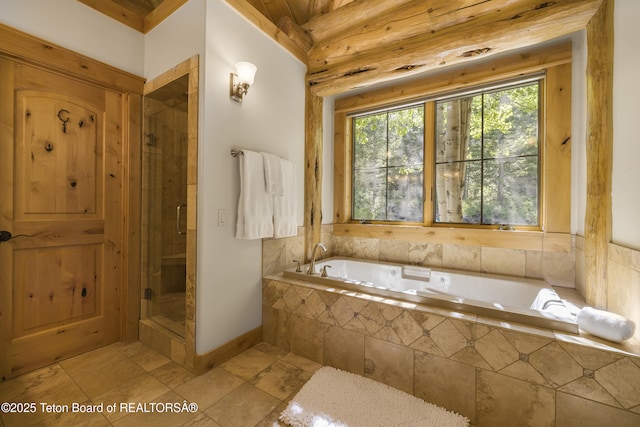8157 Ripplinger Rd, Driggs, ID 83422 - bathroom featuring a garden tub, a stall shower, and tile patterned floors