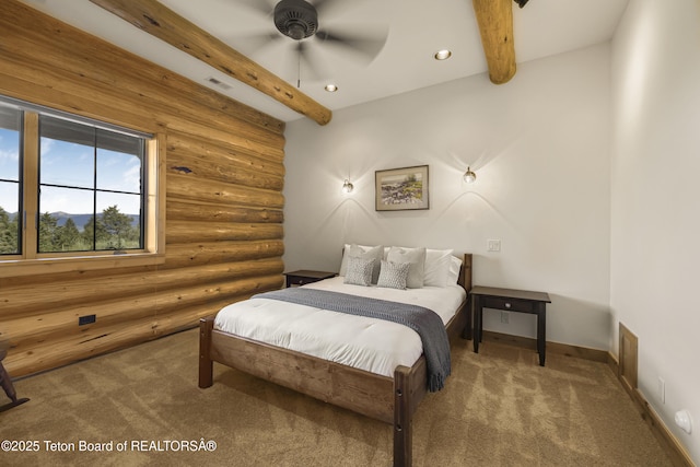 8157 Ripplinger Rd, Driggs, ID 83422 - bedroom featuring rustic walls, carpet flooring, beam ceiling, and recessed lighting