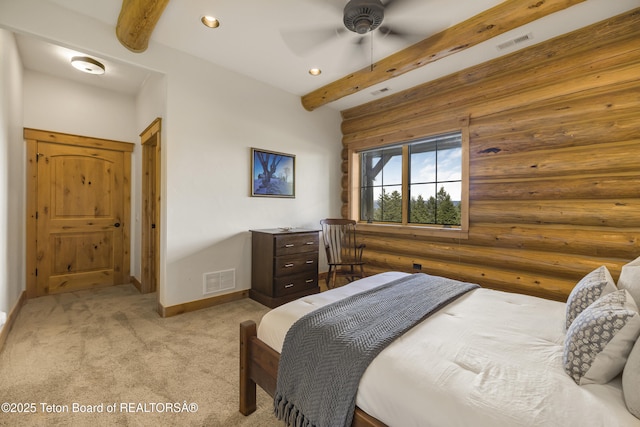 8157 Ripplinger Rd, Driggs, ID 83422 - bedroom with beamed ceiling, light carpet, log walls, recessed lighting, and a ceiling fan