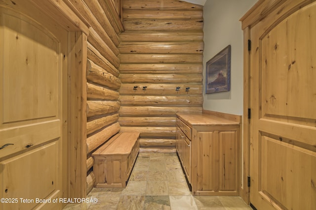 8157 Ripplinger Rd, Driggs, ID 83422 - interior space featuring log walls and stone finish floors