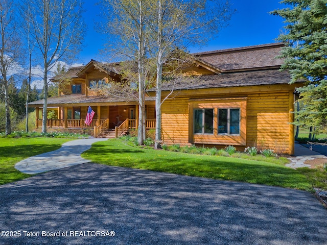590 S Sandhill Crane Rd, Wilson, WY 83014 - view of front of home with a porch and a front yard