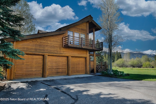 590 S Sandhill Crane Rd, Wilson, WY 83014 - garage featuring a mountain view and asphalt driveway