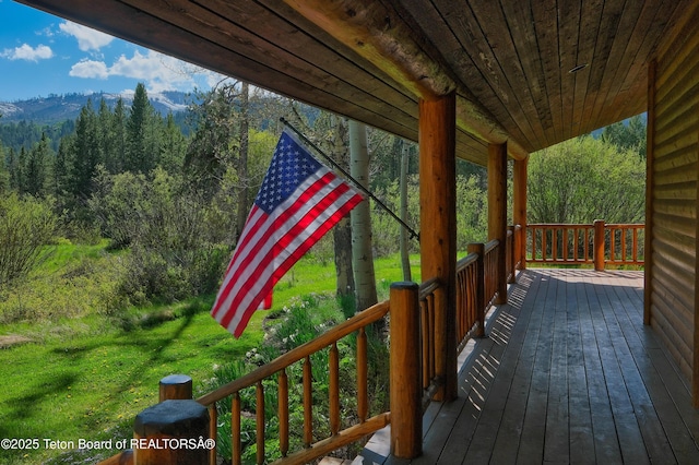 590 S Sandhill Crane Rd, Wilson, WY 83014 - wooden terrace with a wooded view