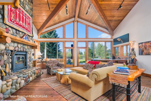 590 S Sandhill Crane Rd, Wilson, WY 83014 - living room featuring track lighting, wood-type flooring, a wood ceiling with exposed beams, healthy amount of natural light, and high vaulted ceiling