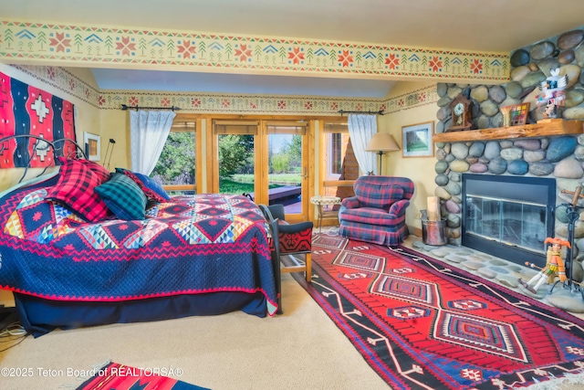 590 S Sandhill Crane Rd, Wilson, WY 83014 - carpeted bedroom with access to outside and a fireplace