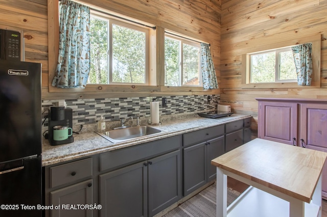 66 Elkhorn Dr, Thayne, WY 83127 - kitchen featuring freestanding refrigerator, gray cabinets, wood counters, and tasteful backsplash