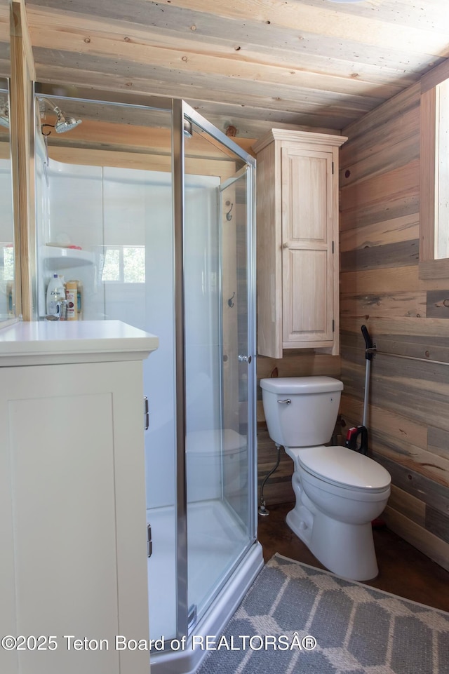 66 Elkhorn Dr, Thayne, WY 83127 - bathroom featuring wood walls and a stall shower