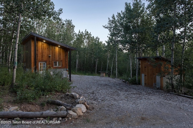 66 Elkhorn Dr, Thayne, WY 83127 - view of shed featuring a view of trees