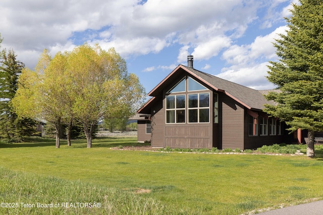 6790 N Timothy Rd, Jackson, WY 83001 - view of home's exterior with a yard
