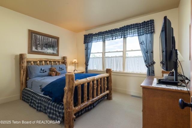 6790 N Timothy Rd, Jackson, WY 83001 - carpeted bedroom featuring baseboards