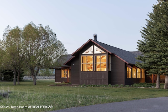 6790 N Timothy Rd, Jackson, WY 83001 - view of front of house featuring a front lawn