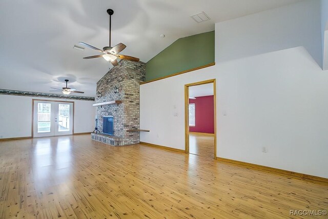 2195 W Huntington Dr, Beverly Hills, FL 34465 - unfurnished living room featuring ceiling fan, light wood-style floors, a brick fireplace, and high vaulted ceiling