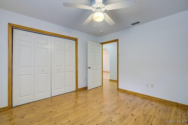 2195 W Huntington Dr, Beverly Hills, FL 34465 - unfurnished bedroom featuring light wood-style floors, a closet, and ceiling fan