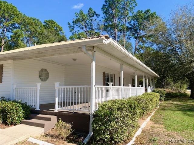 2195 W Huntington Dr, Beverly Hills, FL 34465 - view of property exterior with a porch