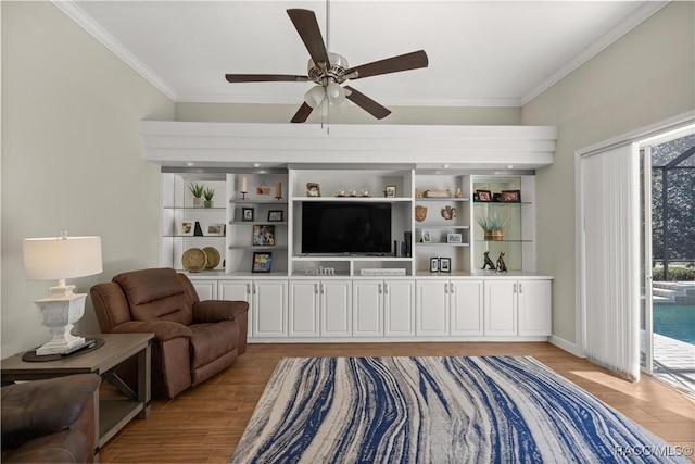 living room featuring ornamental molding, ceiling fan, and light wood-type flooring