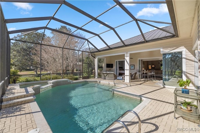 view of pool featuring a patio area and glass enclosure