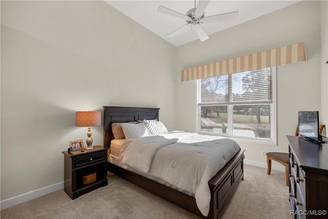 bedroom with ceiling fan, light colored carpet, and lofted ceiling