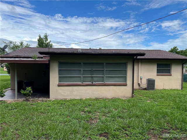 13 N Wadsworth Ave, Beverly Hills, FL 34465 - view of side of home featuring stucco siding and a yard