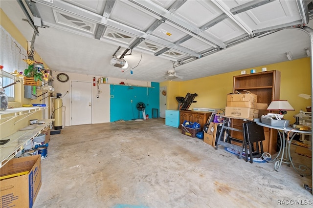 garage with ceiling fan and a garage door opener