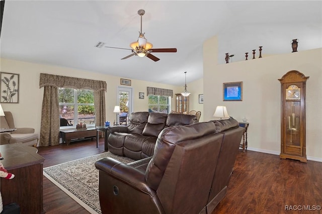 living room featuring ceiling fan, dark hardwood / wood-style flooring, and lofted ceiling