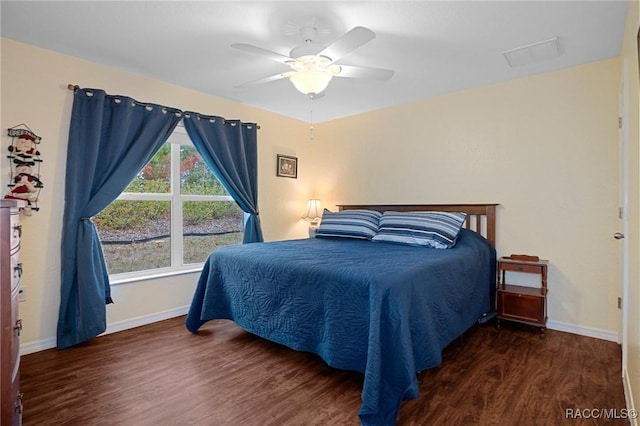 bedroom featuring dark hardwood / wood-style flooring and ceiling fan