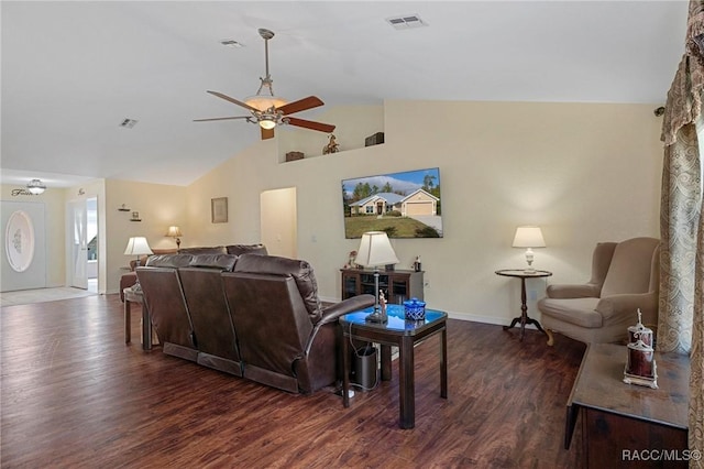 living room featuring dark hardwood / wood-style floors, ceiling fan, and lofted ceiling