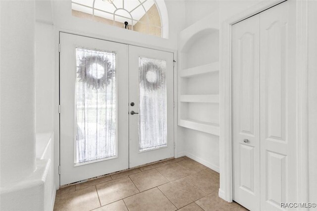 8583 N Tibet Ter, Dunnellon, FL 34433 - foyer with light tile patterned floors, healthy amount of natural light, and french doors
