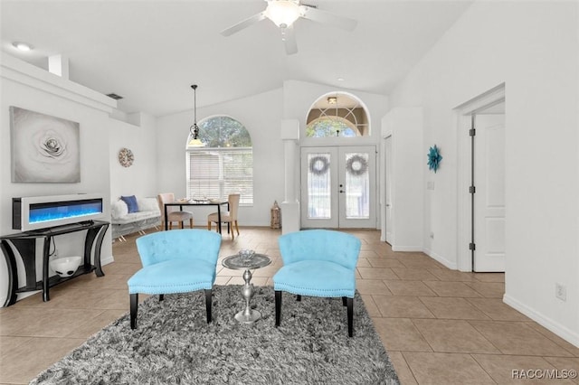8583 N Tibet Ter, Dunnellon, FL 34433 - living room featuring light tile patterned floors, ceiling fan, french doors, and high vaulted ceiling