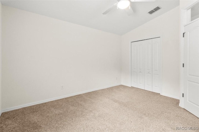8583 N Tibet Ter, Dunnellon, FL 34433 - unfurnished bedroom with carpet, vaulted ceiling, a closet, and a ceiling fan