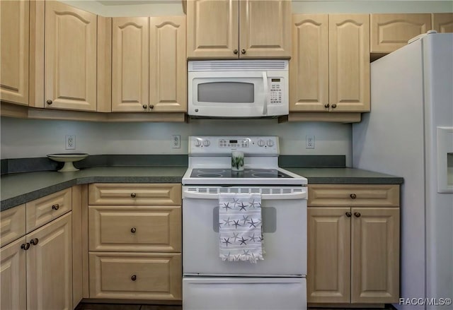 8583 N Tibet Ter, Dunnellon, FL 34433 - kitchen featuring white appliances, dark countertops, and light brown cabinetry