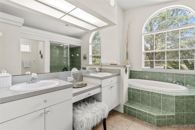 8583 N Tibet Ter, Dunnellon, FL 34433 - full bath featuring healthy amount of natural light, vanity, a bath, and tile patterned floors
