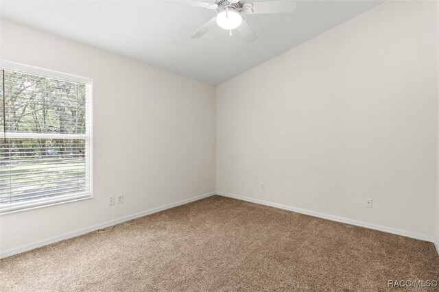 8583 N Tibet Ter, Dunnellon, FL 34433 - unfurnished bedroom featuring vaulted ceiling, carpet floors, a closet, and a ceiling fan