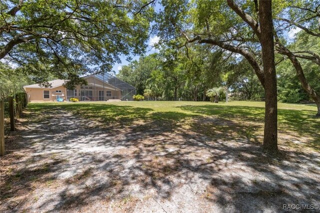 8583 N Tibet Ter, Dunnellon, FL 34433 - view of green lawn with glass enclosure