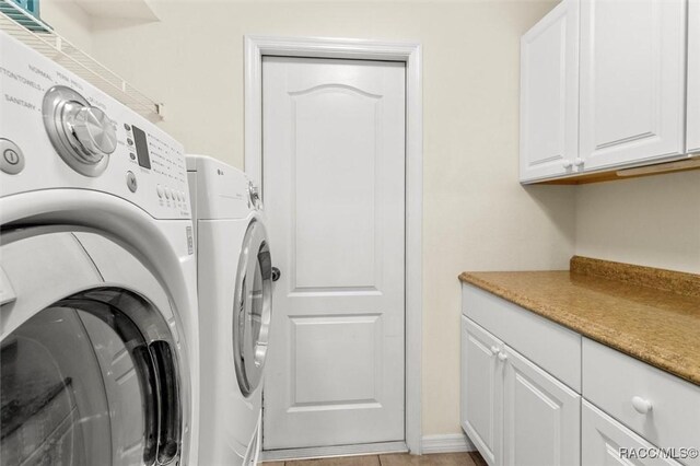 8583 N Tibet Ter, Dunnellon, FL 34433 - washroom with washer and dryer and cabinet space