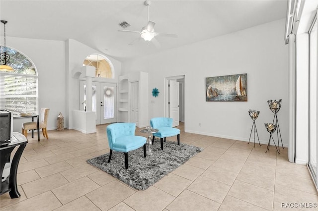 8583 N Tibet Ter, Dunnellon, FL 34433 - sitting room with light tile patterned flooring, ceiling fan, high vaulted ceiling, and french doors