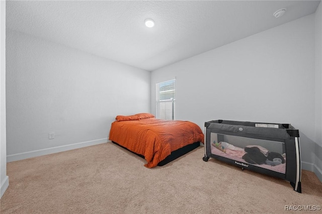 bedroom with light colored carpet