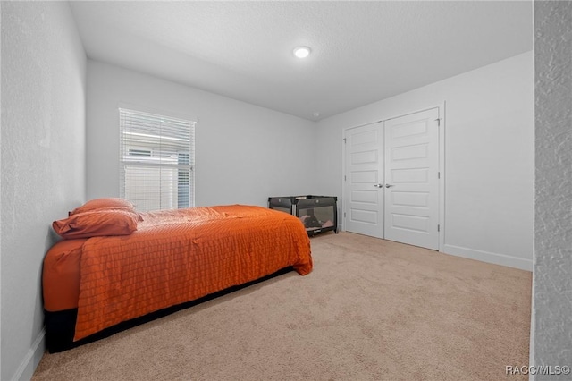 carpeted bedroom featuring a closet