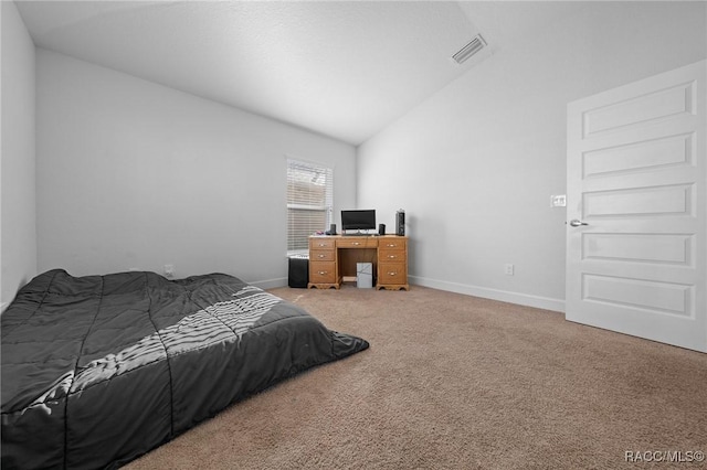 carpeted bedroom with lofted ceiling