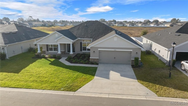 single story home featuring a garage and a front yard