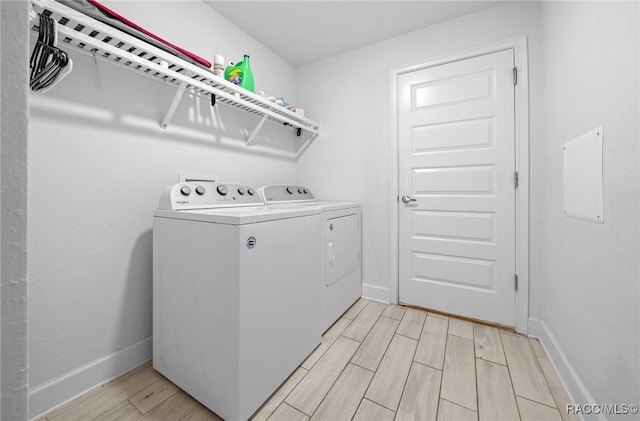 washroom with independent washer and dryer