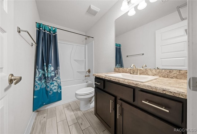 full bathroom featuring toilet, shower / bath combination, and vanity