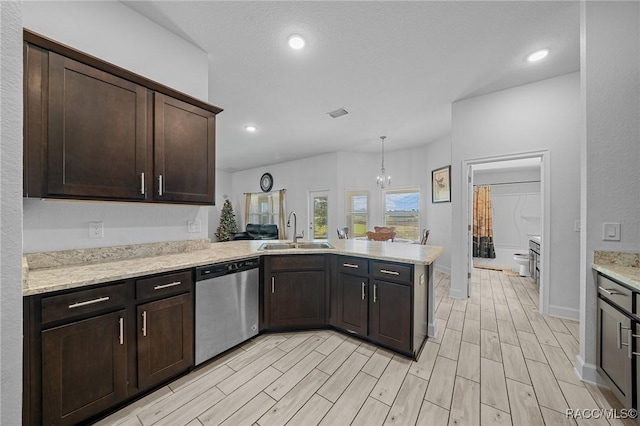 kitchen with dishwasher, kitchen peninsula, sink, hanging light fixtures, and dark brown cabinets